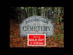 Sign indicating Darkness Falls Cemetery is sold out for Halloween.