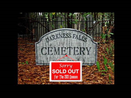 Sign indicating Darkness Falls Cemetery is sold out for Halloween.