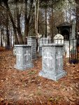 A graveyard with a sold-out sign on a tombstone.
