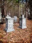 A graveyard with a sold-out sign on a tombstone.