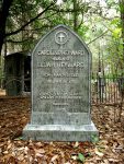 Gravestone of Lew Wallace, author of Ben-Hur, in a wooded cemetery.