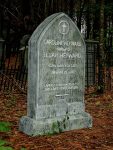 Gravestone of Lew Wallace, author of Ben-Hur, in a wooded cemetery.