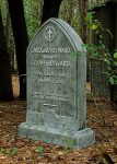 Gravestone of Lew Wallace, author of Ben-Hur, in a wooded cemetery.