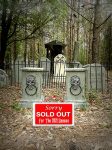 A gated cemetery entrance with a sold-out sign.