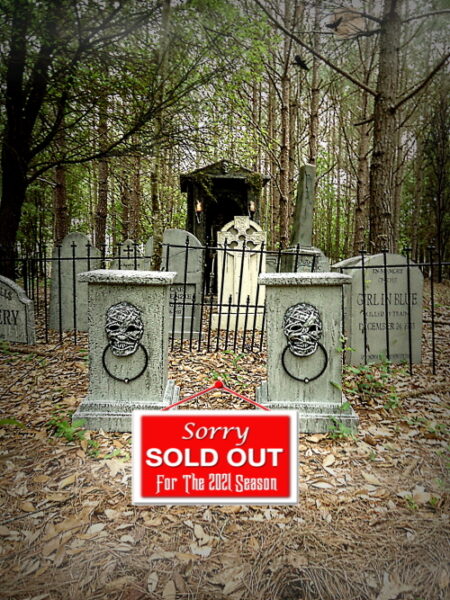 A gated cemetery entrance with a sold-out sign.