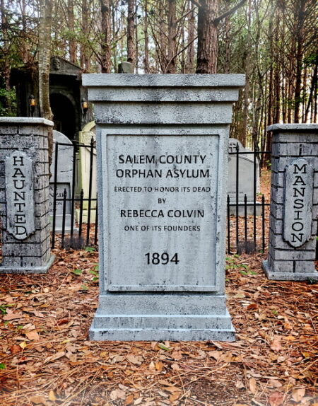 Historic gravestone of Samuel Colvin from 1834 in a wooded cemetery.