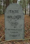 Five humorous tombstones with funny epitaphs in a wooded area.