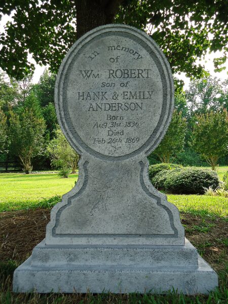 Headstone of W. Hobbs in a serene cemetery setting.